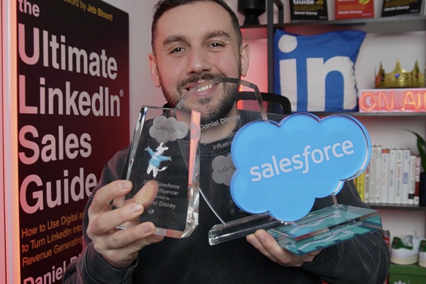 Daniel Disney holding his Salesforce awards